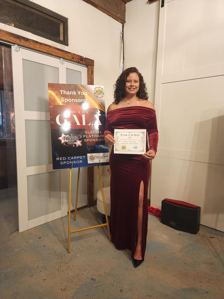 Accepting the Cream of the Crop 2026 certificate for Festus Plumbing at the Fire and Ice Gala
