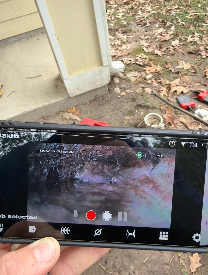 Sewer camera screen showing the inside of a drain line
